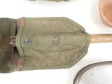 a small bag with a wooden spoon and a spoon rest on a table