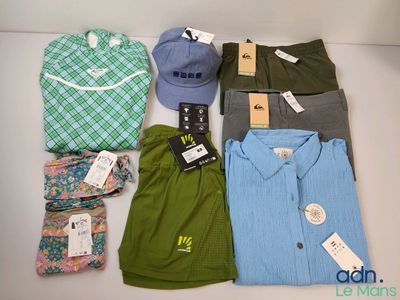 a lot of men ' s clothing on display on the table
