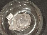 a glass jar with a label on it sitting on a table