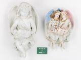 two porcelain figurines of angels on a white background