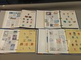 a lot of different stamps on the pages of a book
