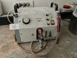 a machine that is sitting on the floor in a room