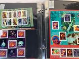 a lot of stamps on the pages of a binder