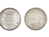une pièce d'argent surmontée d'une couronne