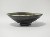 green and black bowl on a white background