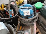 a pile of tools sitting on top of a wooden pallet
