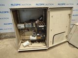 an open metal cabinet with a bunch of electrical equipment inside of it
