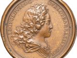 a close up of a coin with a woman ' s head on it