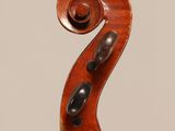 an old violin with a wooden back and bow on a white background