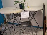 a small table and chairs in the corner of a room