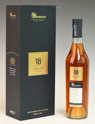 a bottle of 18 year old whisky next to a box