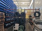 several stacks of tires are stacked on pallets in a warehouse