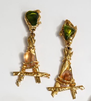 two pairs of gold earrings with green and pink stones on them