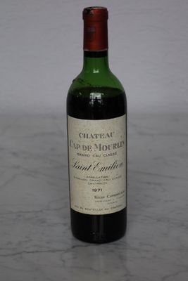 a bottle of wine that is sitting on a table