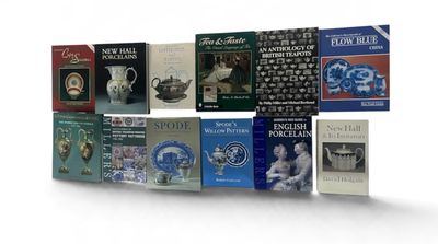 a lot of books that are stacked together on a shelf