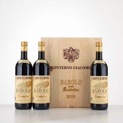 three bottles of wine in front of a wooden box