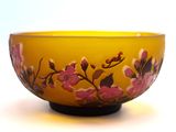a yellow bowl with a floral design on it