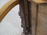a close up of a wooden table with a clock on top of it