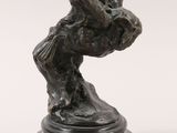 an image of a bronze statue of a bird on a pedestal