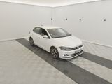 the white car is parked in the garage on the checkered floor