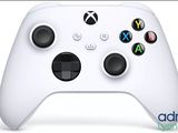 a close up of a white controller on a white surface