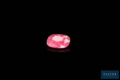 a pink diamond on a black background