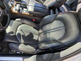 the interior of a car with black leather seats and a steering wheel