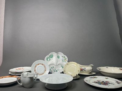 a lot of plates and cups sitting on a table