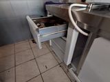 an image of a kitchen with a sink and a stove