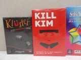 three books are lined up on a table with a white background