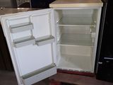 a refrigerator that is open and sitting in a room