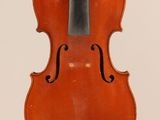 an old violin with a bow hanging from it ' s back