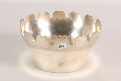 a silver bowl that is sitting on a table
