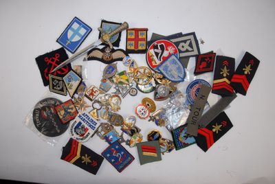 a lot of badges on a white surface