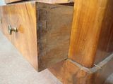 a close up of a wooden dresser with two drawers