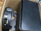 a box that has a black suitcase inside of it