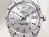 an image of a silver rolex watch with a white dial