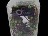 a clear box with a bunch of green berries inside of it