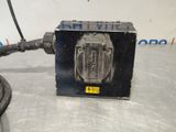 an image of a black box with a cord connected to it