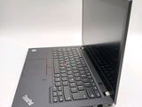 a black laptop with a black keyboard on a white surface