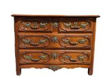 an image of a wooden chest of drawers with brass handles