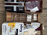 many boxes of mail sitting on the floor next to each other