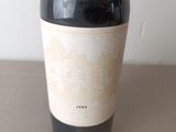 a bottle of wine that is sitting on a table