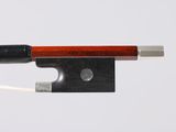 a close up of a violin bow on a white background