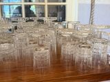 a lot of empty glasses sitting on a table