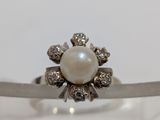 sterling silver ring with a pearl and diamonds