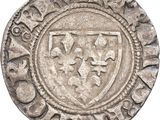 a close up of a silver coin with a shield on it