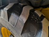 a close up of a large tire on a truck