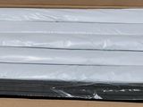 a cardboard box filled with a bunch of white sheets