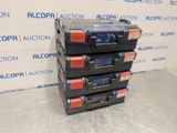 a stack of four boxes of batteries sitting on top of each other